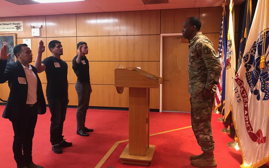 Cesar Vargas (left) participates in an Army Oath of Enlistment ceremony in 2018. 