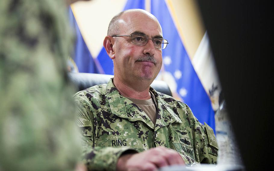 In this Wednesday, April 17, 2019, photo reviewed by U.S. military officials, U.S. Navy Rear Adm. John Ring, Joint Task Force Guantanamo Commander, pauses while speaking during a roundtable discussion with the media, at Guantanamo Bay Naval Base, Cuba. Military officials say that Ring has been fired for a loss of confidence in his ability to command. A statement from U.S. Southern Command says Ring was relieved of duty Saturday, April 27.