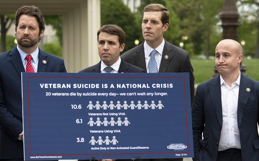 Standing behind a suicide awareness poster at a Capitol Hill press conference on April 29, 2019 are, left to right, Reps. Joe Cunningham, D-S.C., Chris Pappas, D-N.H., Conor Lamb, D-Pa., and Max Rose, D-N.Y.