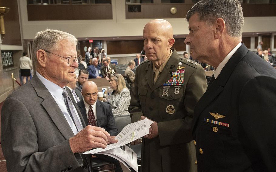 Senate Armed Services Committee Chairman James Inhofe, R-Okla, talks with Marine Corps Commandant nominee Lt. Gen. David H. Berger and Chief of Naval Operations nominee Adm. William F. Moran before their confirmation hearing on Capitol Hill, Apr. 30, 2019.