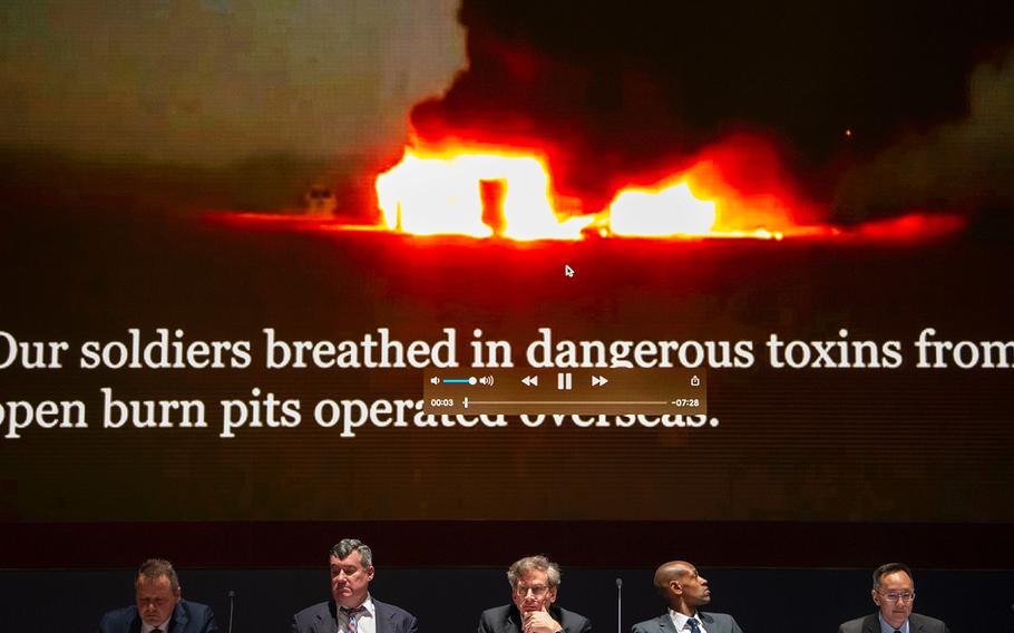 A panel of experts look on during a briefing at the U.S. Capitol in Washington on Tuesday, April 30, 2019, at the start of a short documentary video on troops who suffered from exposure to toxins released from burn pits at overseas locations.