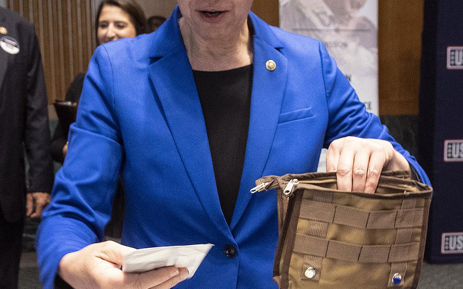 Sen. Tammy Baldwin, D-Wis., prepares a snack package for U.S. servicemembers during a USO event at the Dirksen Senate Office Building on Capitol Hill, April 30, 2019.