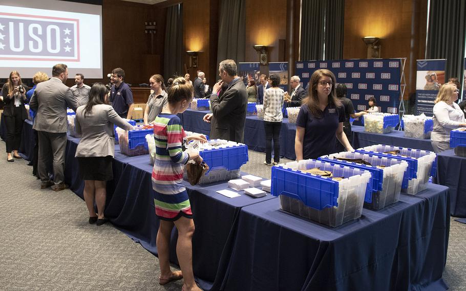 Volunteers prepare snack packages for U.S. servicemembers during a USO event at the Dirksen Senate Office Building on Capitol Hill, April 30, 2019.