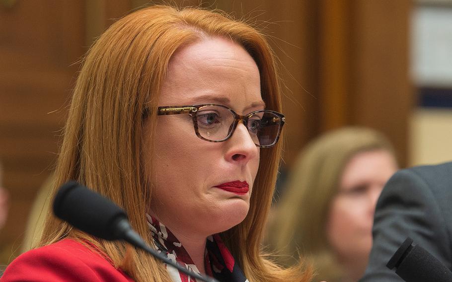 Air Force veteran Rebecca Lipe sheds tears while testifying during a hearing on Capitol Hill in Washington on Tuesday, April 30, 2019.