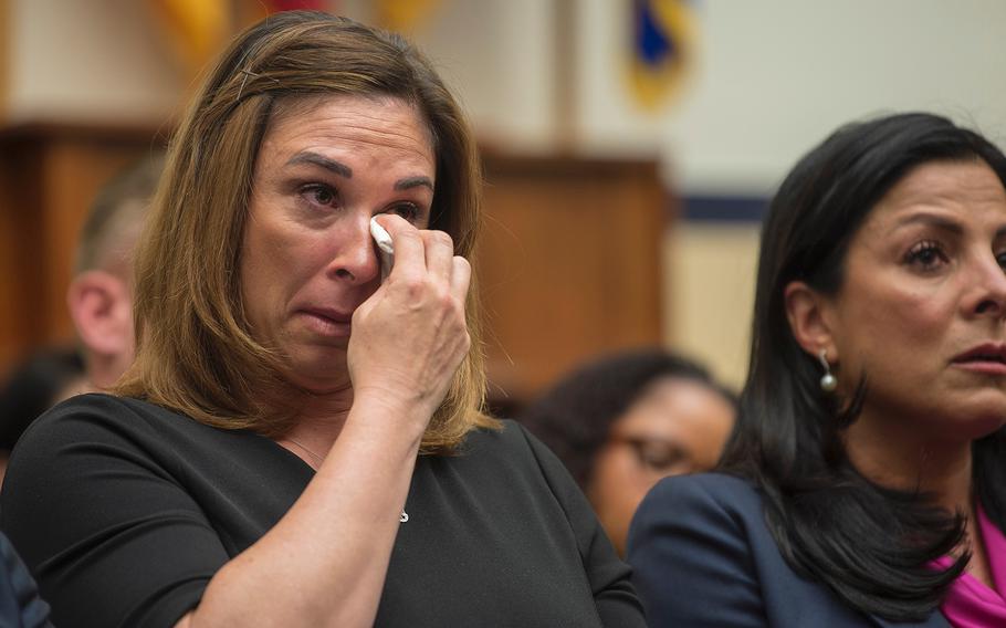 Megan Stayskal wipes away tears as her husband Army Green Beret Sgt. 1st Class Richard Stayskal testifies during a hearing on Capitol Hill in Washington on Tuesday, April 30, 2019.