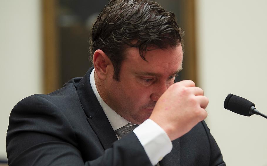 Army Green Beret Sgt. 1st Class Richard Stayskal pauses to hold back tears while testifying during a hearing on Capitol Hill in Washington on Tuesday, April 30, 2019.