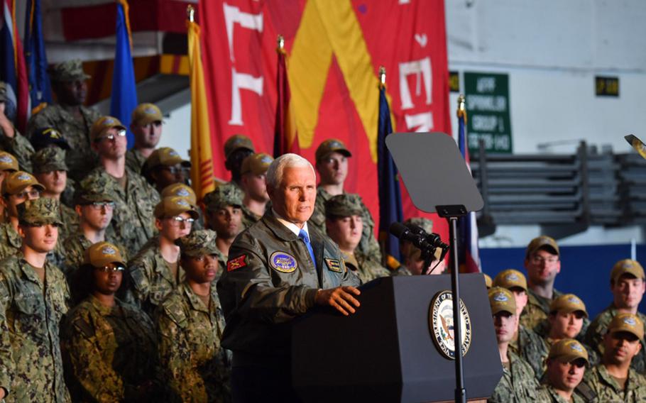 Vice President Mike Pence speaks to sailors at an all-hands call aboard the Nimitz-class aircraft carrier USS Harry S. Truman.