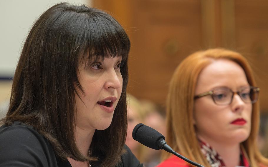 Alexis Witt, widow of Air Force Staff Sgt. Dean Witt, testifies during a hearing on Capitol Hill in Washington on Tuesday, April 30, 2019. Also testifying at right is Air Force veteran Rebecca Lipe.