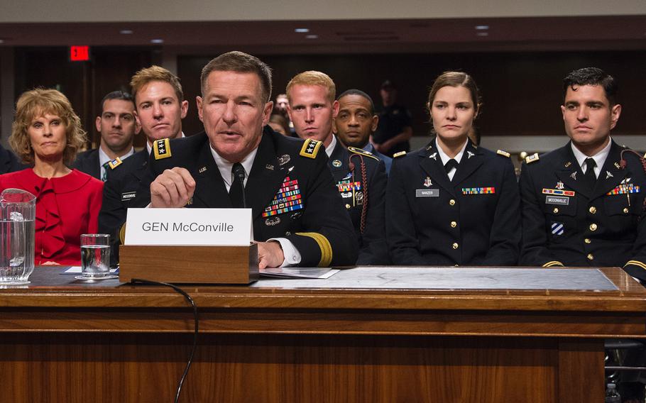 Gen. James McConville introduces his family at a hearing on Capitol Hill in Washington on Thursday, May 2, 2019, as members of the Senate Armed Services Committee considered the general's nomination to become the Army's next chief of staff. Looking on in the background are from left, McConville's wife, Maria, an Army veteran; his son Michael, an Army captain; his son-in-law Ryan Nanzer, an Army staff sergeant; his daughter Jessica Nanzer, an Army captain; and his son Ryan, also an Army captain.