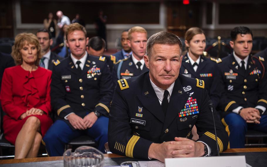 Gen. James McConville prepares to introduce his family during a hearing on Capitol Hill in Washington on Thursday, May 2, 2019, as members of the Senate Armed Services Committee considered the general's nomination to become the Army's next chief of staff. 