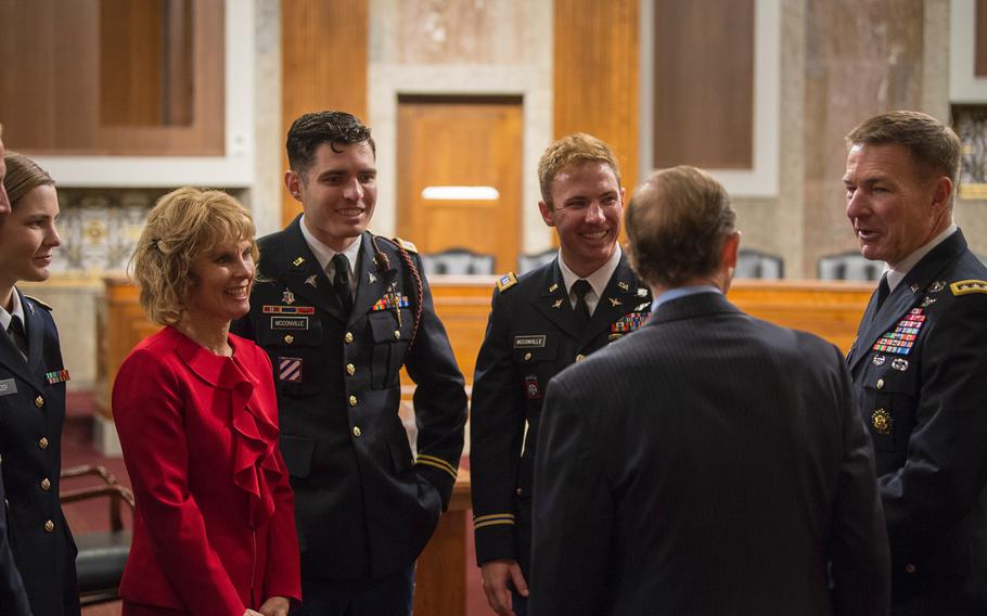 Gen. James McConville speaks with Sen. Richard Blumenthal, D-Conn., prior to the start of a Senate Armed Services Committee hearing to consider McConville's nomination to become the Army's next chief of staff. Looking on from right to left are the general's family members: sons Michael and Ryan, both Army captains, wife Maria, daughter Jessica Nanzer, an Army captain and her husband, not seen, Army Staff Sgt. Ryan Nanzer.