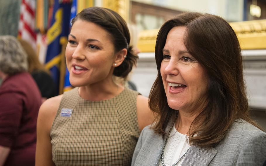 Second lady Karen Pence, wife of Vice President Mike Pence, has her picture taken with Navy spouse Lindsay Bradford after a briefing in the Russell Senate Building on Capitol Hill in Washington on Thursday, May 9, 2019.