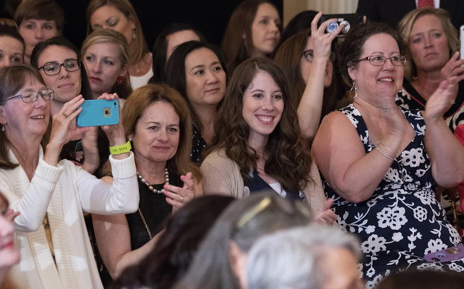 Military mothers and spouses applaud as first lady Melania Trump speaks during the third annual Celebration of Military Mothers at the White House, May 10, 2019.