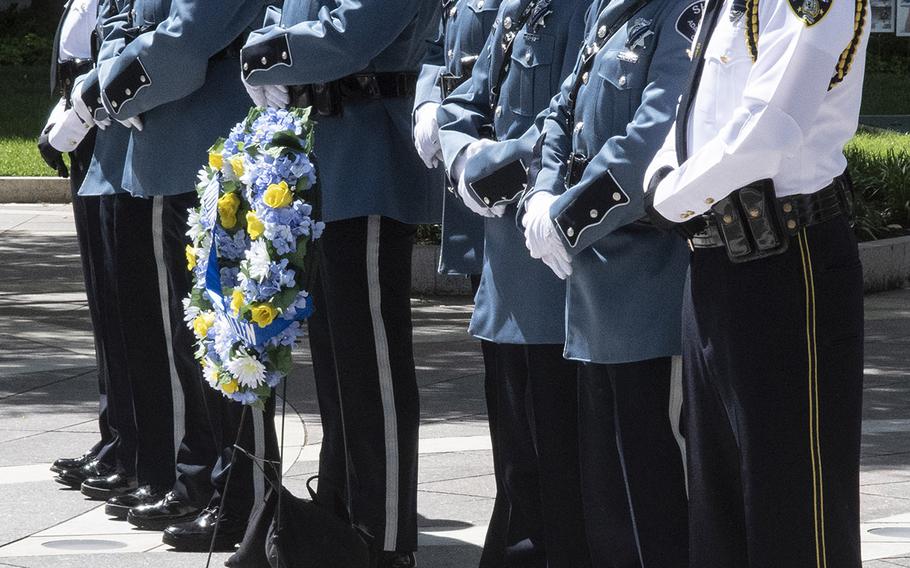 Officers from the Adams County, Colo., Sheriff's Department and the Mount Dora Police take their turn as honor guard during National Police Week at the National Law Enforcement Officers Memorial in Washington, D.C., May 14, 2019.