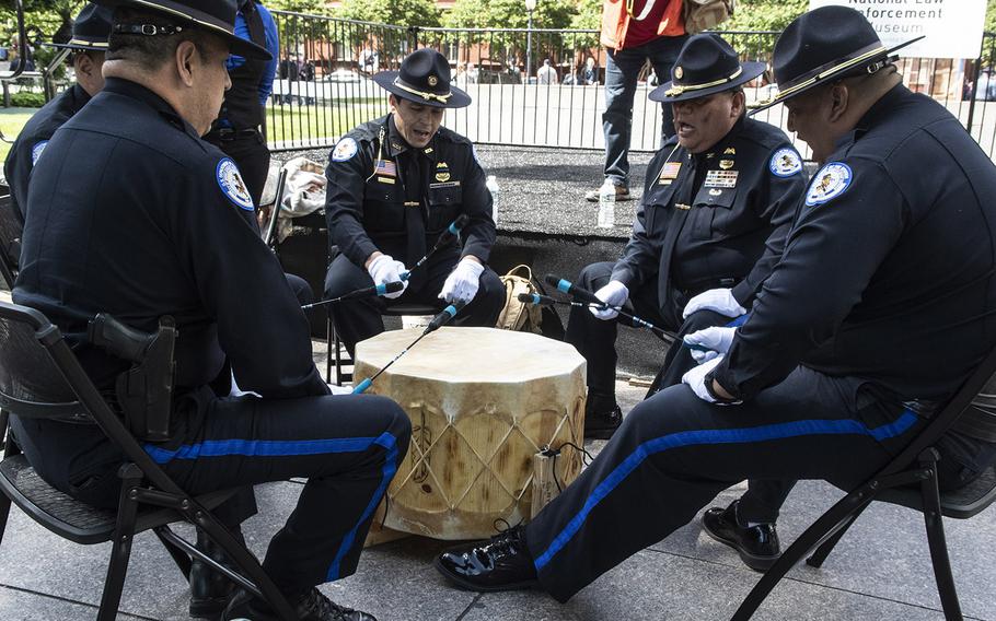 Native American police officers take part in a drum ceremony during National Police Week at the National Law Enforcement Officers Memorial in Washington, D.C., May 14, 2019.