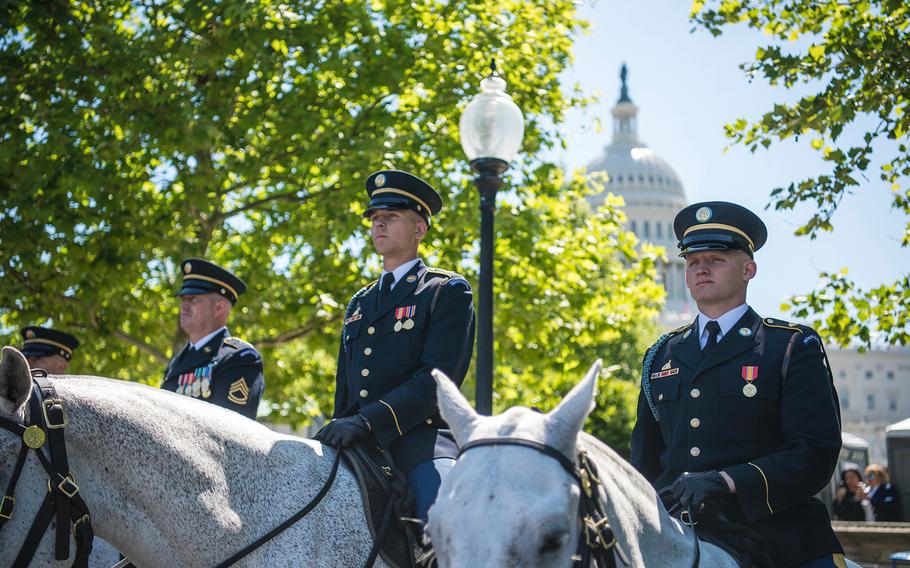 Horse-mounted police serve as an honor guard welcoming the thousands of people streaming into the U.S. Capitol in Washington on Wednesday, May, 15, 2019, for the 38th annual national memorial service to honor law enforcement personnel who have fallen in the line of duty.
