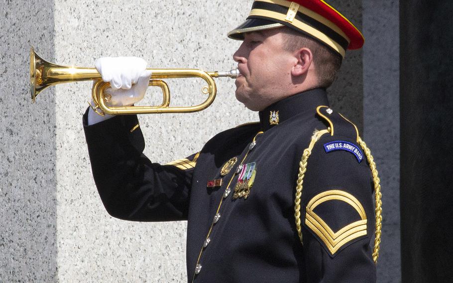 A bugler plays taps on Memorial Day at the National World War II Memorial in Washington, D.C., May 27, 2019.