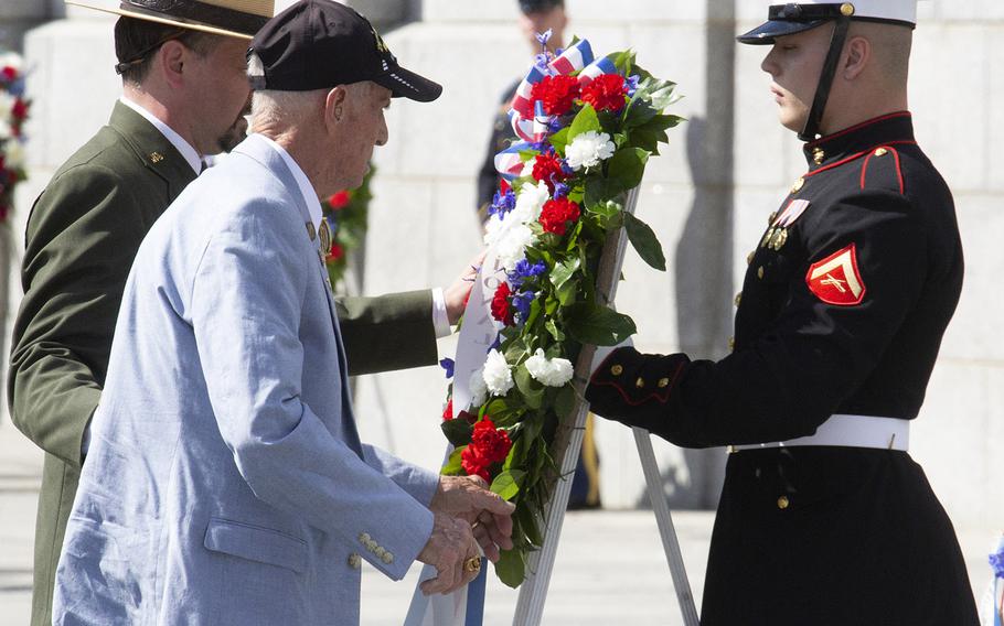 National Park Service Acting Superintendent Jeffrey Reinbold and World War II veteran Carmel Whetzel place a wreath during a Memorial Day ceremony at the National World War II Memorial in Washington, May 27, 2019.