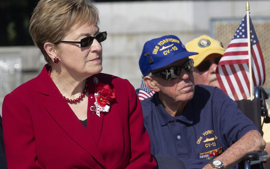 Rep. Marcy Kaptur, D-Ohio, and World War II veteran Andrew Abugelis listen to a speaker on Memorial Day at the National World War II Memorial in Washington, D.C., May 27, 2019.