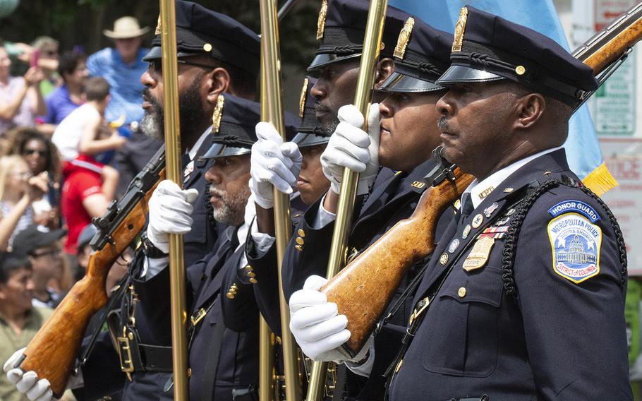 The Washington, D.C. Police honor guard marches in the National Memorial Day Parade, May 27, 2019.