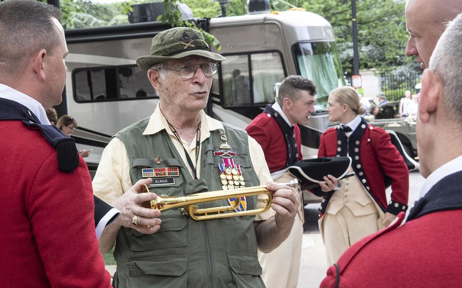 Mark Elrod, who was part of the Old Guard's Fife and Drum Corps years ago, talks with current members before the National Memorial Day Parade in Washington, D.C., May 27, 2019.