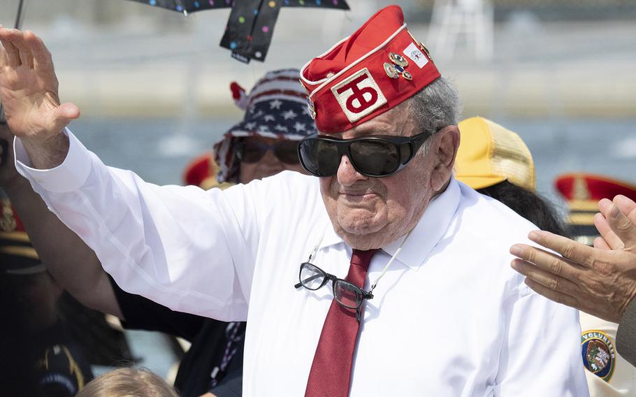 World War II veteran Robert Levine waves as he's introduced at a ceremony marking the 75th anniversary of D-Day, June 6, 2019 at the National World War II Memorial in Washington, D.C.
