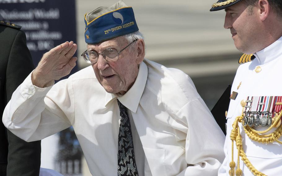 Donald McKee, who landed in Normandy on D-Day +1, salutes during a ceremony marking the 75th anniversary of D-Day, June 6, 2019 at the National World War II Memorial in Washington, D.C.