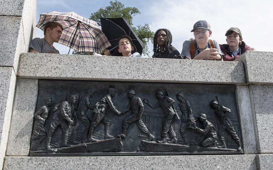 Spectators at a ceremony marking the 75th anniversary of D-Day, June 6, 2019 at the National World War II Memorial in Washington, D.C.