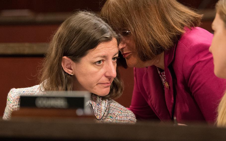Rep. Annie Kuster, D-N.H., right, whispers to Rep. Elaine Luria, D-Va., during a hearing on Capitol Hill in Washington on Thursday, June 20, 2019. The hearing examined the Department of Veterans Affairs' decisions about disability benefits for veterans who claim they suffer from post-traumatic stress disorder related to military sexual assault. 
