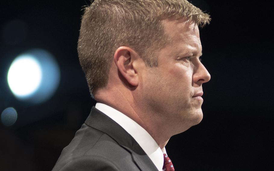 Under Secretary of the Army Ryan McCarthy stands for the national anthem during an event at Fort Myer-Henderson, Va., on Wednesday June 19, 2019.