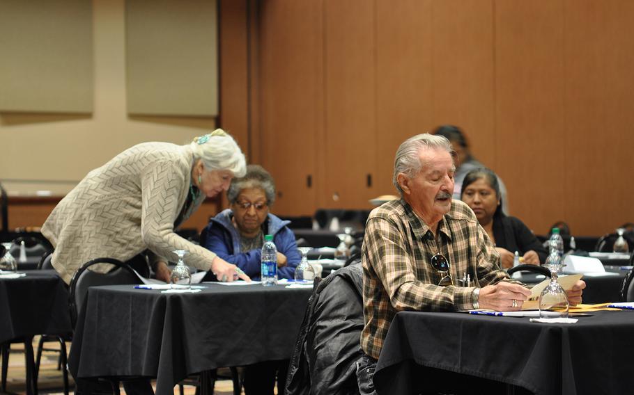 Carol Wild Scott, chairman of the Veterans and Military Law Section of the Federal Bar Association, assists a veteran’s family on Tuesday, Nov. 6, 2018, at the Ohkay Hotel Casino in Ohkay Owingeh, N.M. Scott traveled to the pueblo to educate veterans about getting connected to VA benefits.