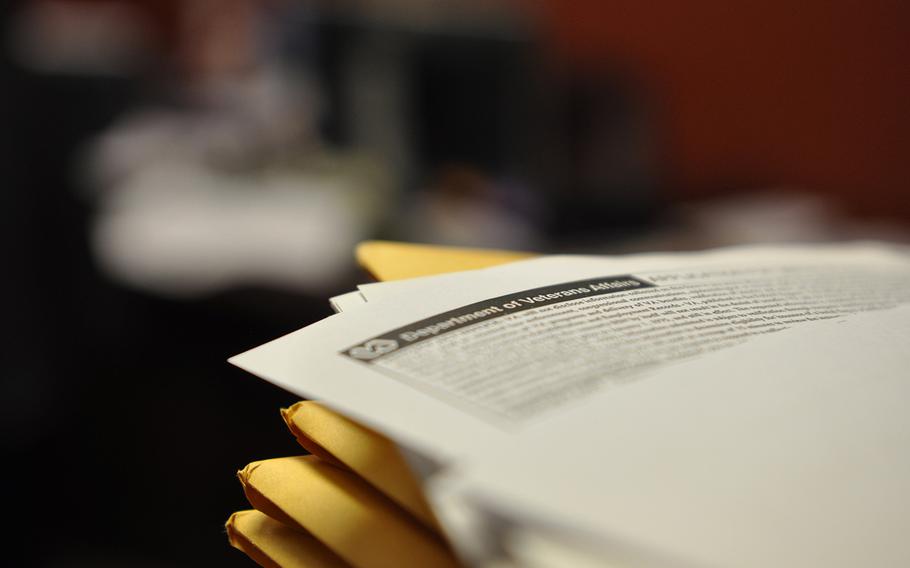 Department of Veterans Affairs paperwork sits on the desk of Michael Montoya, an advocate for veterans in his home pueblo of Ohkay Owingeh, N.M.