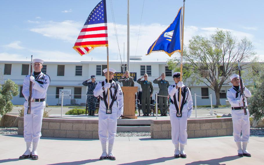 Naval Air Weapons Station China Lake's color guard presents the colors during the national anthem at the Naval Air Warfare Center Weapons Division change of command ceremony April 19, 2019 in China Lake, California. 