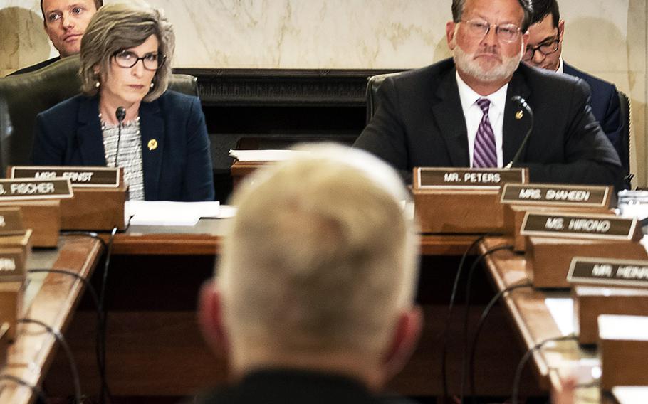 Senate Armed Services Subcommittee on Emerging Threats and Capabilities Chairman Sen. Joni Ernst, R-Iowa, and Ranking Member Sen. Ralph Peters, D-Mich., listen as Adm. Craig S. Faller, commander of the U.S. Southern Command, testifies at a hearing on Capitol Hill, July 9, 2019.
