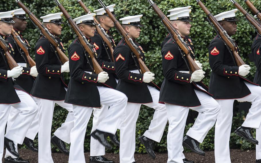 Members of the United States Marine Corps march during the passage of command ceremony at the Marine Barracks Washington, D.C., July 11, 2019. Gen. David H. Berger became the 38th Commandant of the Marine Corps, replacing retiring Gen. Robert Neller.