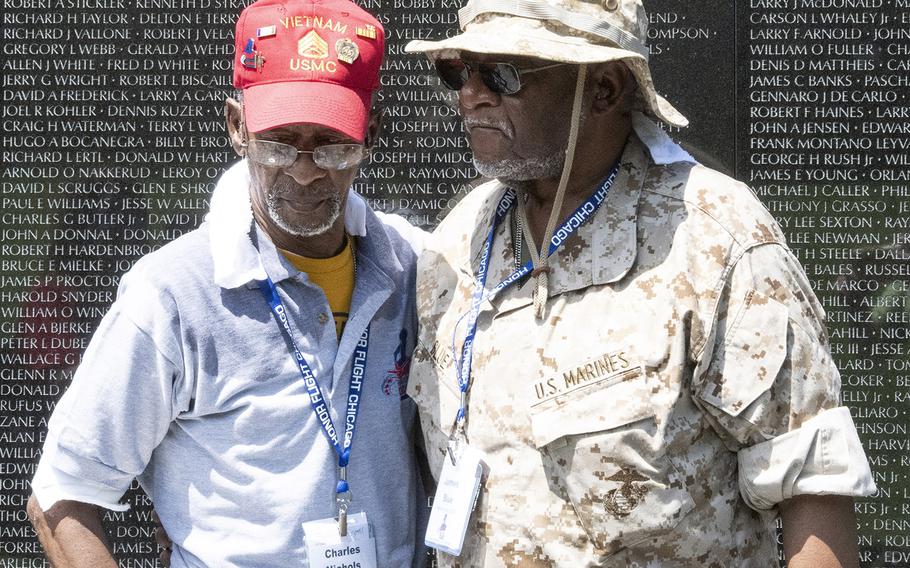 Charles Nichols and James Blue stand together at the Vietnam Veterans Memorial in Washington, D.C. on Wednesday, July 10, 2019. The two Vietnam veterans visited the nation's capital as part of Honor Flight Chicago, a nonprofit that flies vets out for a one-day trip.
