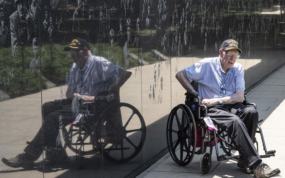 A Korean War veteran sits in front of the Korean War Veterans Memorial in Washington, D.C. on Wednesday, July 10, 2019. He visited the memorial as part of Honor Flight Chicago's 92nd flight.
