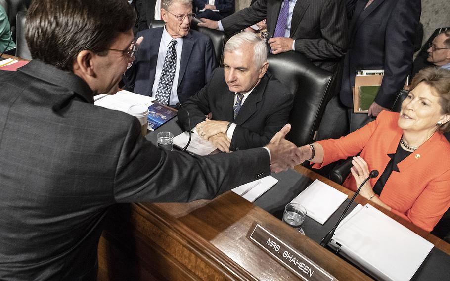 Secretary of the Army Mark Esper shakes hands with Sen. Jeanne Shaheen, D-N.H., before a Senate Armed Services Committee hearing on his nomination to serve as secretary of defense, July 16, 2019 on Capitol Hill. In the background are Chairman James Inhofe, R-Okla., and Ranking Member Jack Reed, D-R.I.
Joe Gromelski/Stars and Stripes