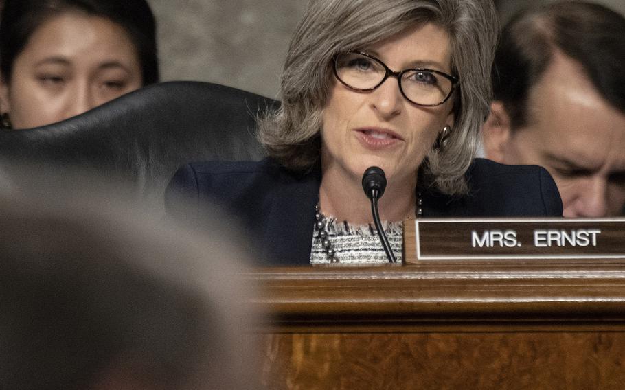 Sen. Joni Ernst, R-Iowa, questions DOD Comptroller David Norquist, foreground, during his deputy secretary of defense confirmation hearing on Capitol Hill, July 24, 2019.