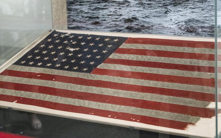 A flag that flew on a landing craft control vessel during the 1944 D-Day landings at Utah Beach, France, was unveiled at the Smithsonian National Museum of American History in Washington, D.C. on Friday, July 26.