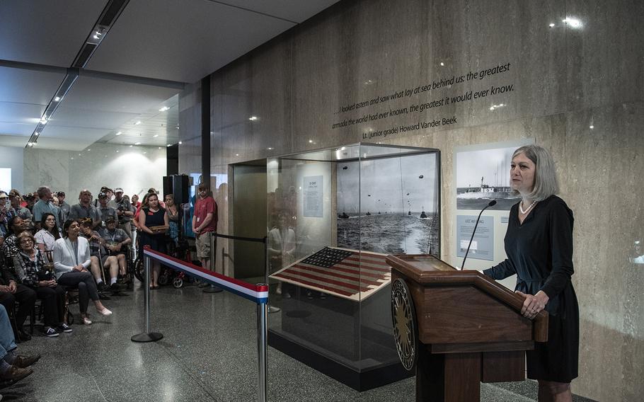 Anthea Hartig, the director of the Smithsonian National Museum of American History in Washington, D.C., speaks at the opening of a display featuring a flag from the 1944 D-Day landings at Utah Beach, France, on July 26, 2019.