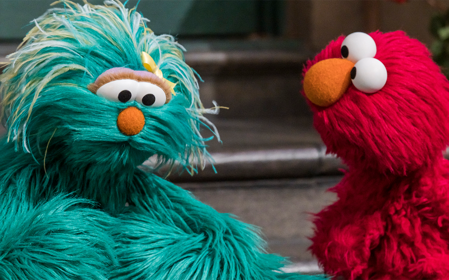 Rosita and Elmo talk in one of the Sesame Street for Military Families: Caregiving videos. 