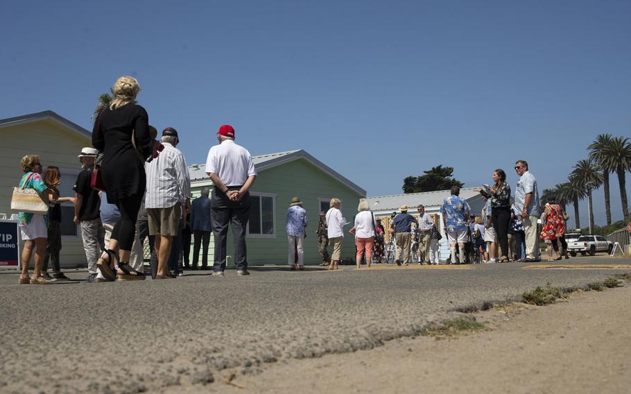 Marines and their family members, along with representatives from the San Diego Nice Guys charity and Marine Corps Community Services, tour new beach cottages before a dedication ceremony at San Onofre Beach on Marine Corps Base Camp Pendleton, Calif., Aug. 15, 2019.

