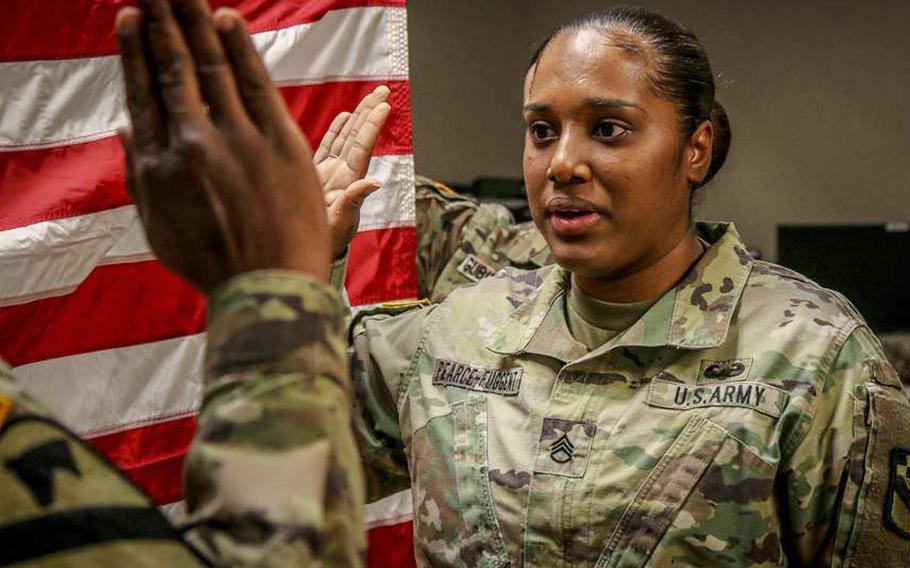 In a December, 2018 file photo, Staff Sgt. Kayle Pearce-Fuggent of HHC 525th Military Intelligence Brigade, a human resources specialist from Miami, Fla., takes the oath of reenlistment leading up to a special duty assignment in Fort Sill, Oklahoma as a Drill Sergeant.