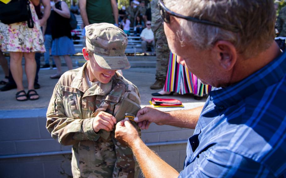 First Lt. Chelsey Hibsch receives her Ranger tab after graduating from the U.S. Army Ranger School Aug. 30, 2019, at Fort Benning, Ga.