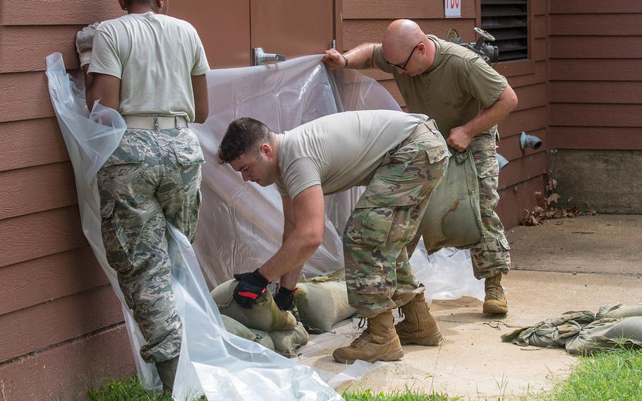 U.S. Air Force Airmen set up sandbags in preparation for Hurricane Dorian at Joint Base Langley-Eustis, Va., Sept. 5, 2019. Entryways and vents at buildings across the installation were sealed with sandbags in response to flood projections.