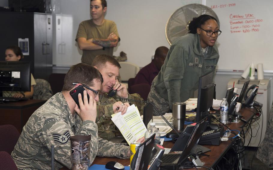 U.S. Air Force Airmen assigned to the emergency operations center compile information for the crisis action team to make informed decisions in preparation for Hurricane Dorian at Joint Base Langley-Eustis, Va., Sept. 5, 2019.
