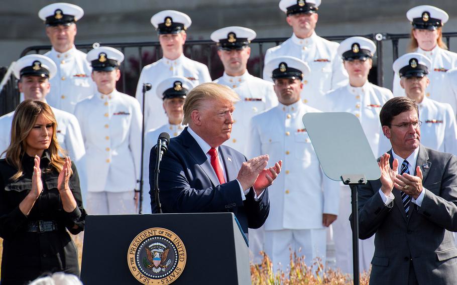 President Donald Trump, Defense Secretary Mark Esper, and Melania Trump applaud during a ceremony Wednesday, Sept. 11, 2019 at the Pentagon commemorating the 9/11 terrorist attacks.