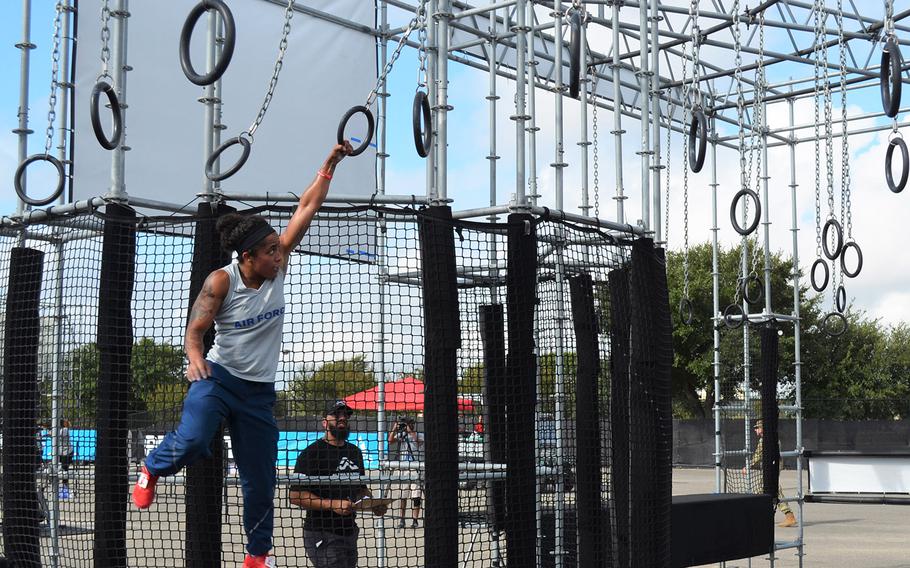 Air Force Airman 1st Class Elizabeth Jackson of Peterson Air Force Base, Colo., swings through an obstacle at the Alpha Warrior Proving Ground in San Antonio on Thursday.