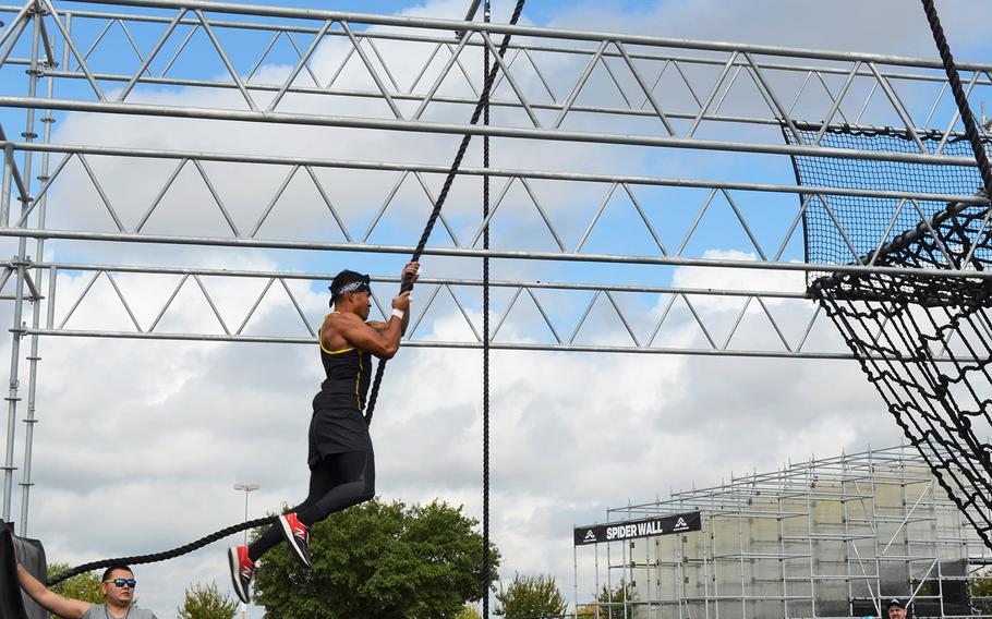 Army 2nd Lt. Chris Gabayan of Fort Bragg, N.C., swings through an obstacle at the Alpha Warrior Proving Ground in San Antonio on Thursday. Gabayan has made two appearances on the TV show "American Ninja Warrior," which is a similar style athletic competition.